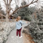 Heather admiring some green plants at the Desert Botanical Gardens