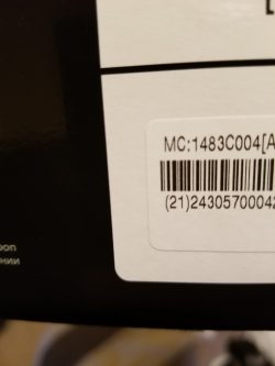 There is a bar code and underneath, a serial number. The first two digits in parenthesis are the country code. 21 is the country code for the US.